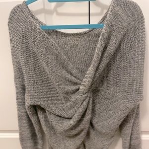 Sweater with a twist in the back